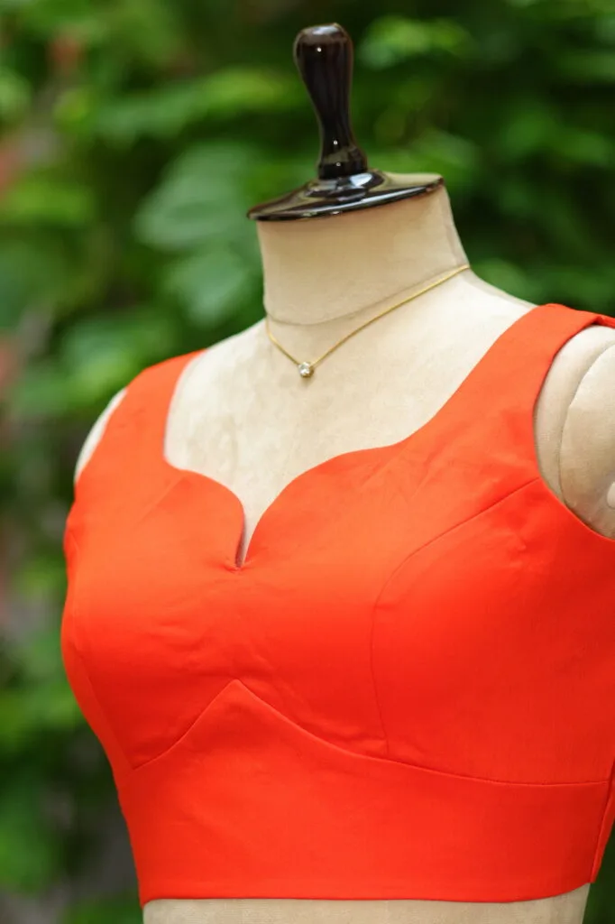 sabyasachi cut – Blouse in Orange, side view | Tilattama