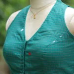 Check Jamdani Celeb Halter – Blouse in Rama green, side view | Tilattama
