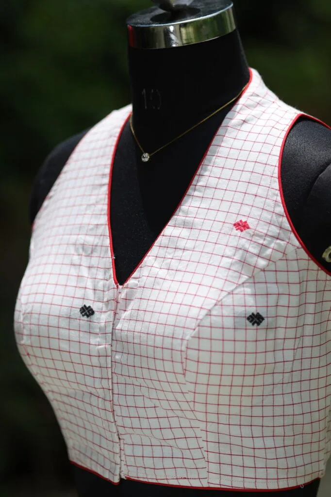 Check Jamdani Celeb Halter – Blouse in white & red, side view | Tilattama