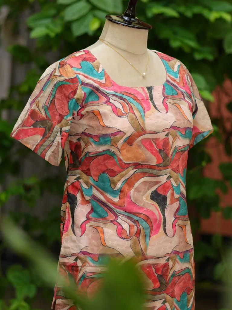 Multi Floral Chikan – Kurti in Cream, side view | Tilattama