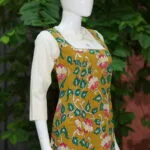 Pen Kalamkari Baby Collar One Piece – Kurti in Neon Pista, side view | Tilattama
