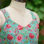 Sangeneri Noodles Strap Kurti – Kurti in Rama green, side view | Tilattama
