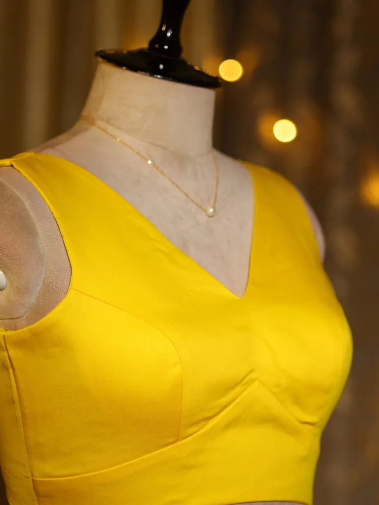 Sabyasachi Celebrity – Blouse in Yellow 38 Sleeveless, side view | Tilattama